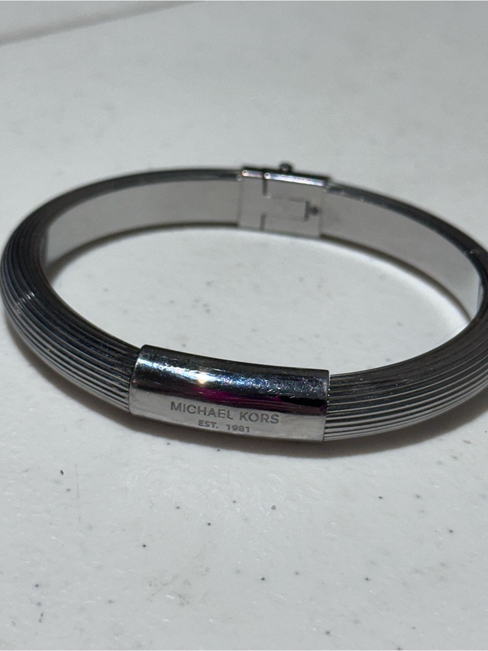 Michael Kors ribbed logo plaque bangle bracelet silver tone
